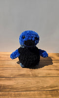 Peluche de patito con ojos negros